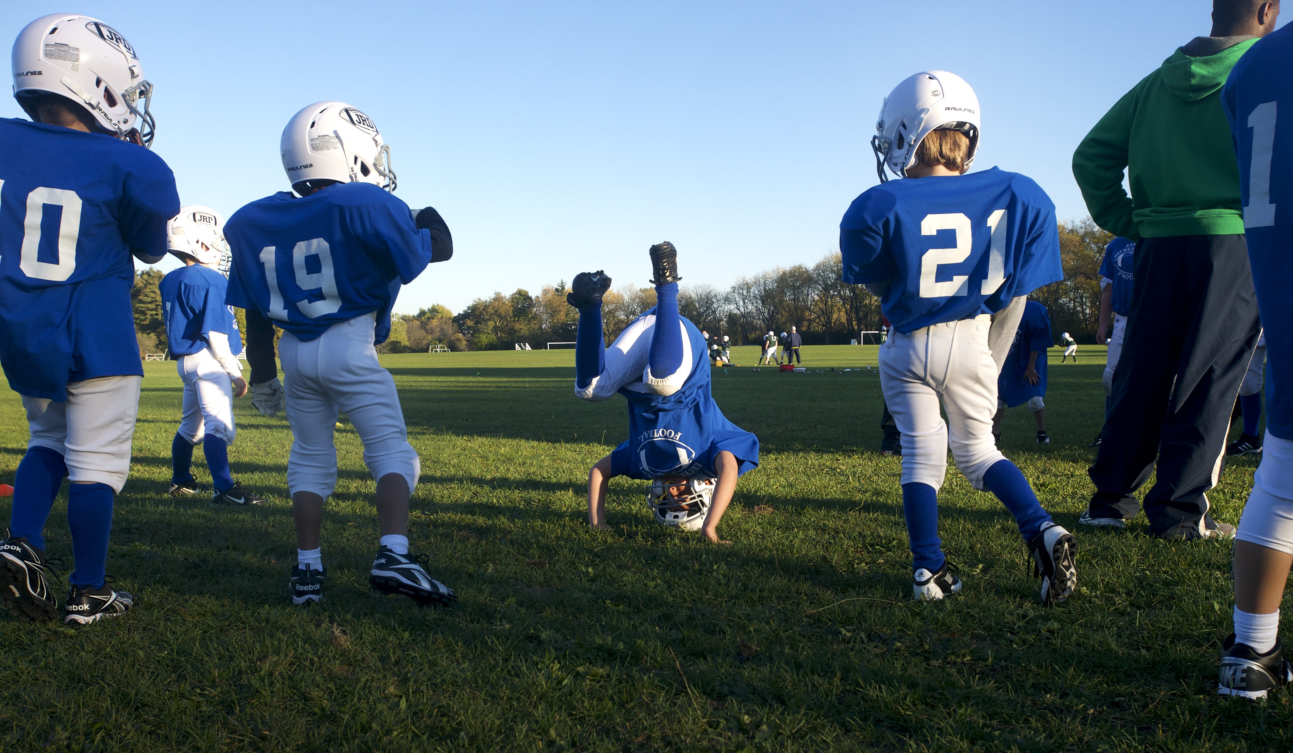Players goof off before the snap at the Lions 3rd and 4th grade football practice in Jackson, Mich. on Monday, October 8, 2012. The Lions are undefeated so far this season.